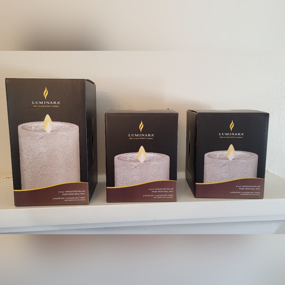 Price Drop!!  New In Box LUMINARA silver flameless pillar candles New with tags